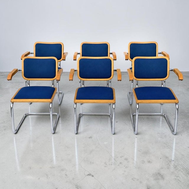 Beautiful set of 6 vintage cesca style dining chairs by Lowenstein. These chairs have wood and blue fabric seats, with...