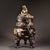 An exceptional solid-copper incense burner finished in rich gilt gold-and-silver, adorned with fine high-relief carving....