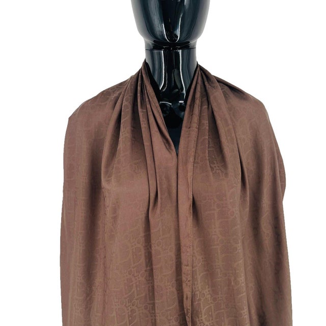 Christian Dior Brown Monogram Wool Silk Scarf. Tone-on-tone brown Dior Oblique monogram jacquard stole with a satin band...