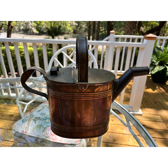 Charming vintage brass watering can with a very nice patina. This useful piece features a classic cylindrical form,...