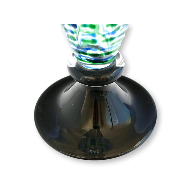 Carlo Moretti Murano glass carafe showcasing a striking interplay of vivid green, cobalt blue, and milky white in a...