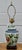 Vintage (1980's) Table Lamp has an Asian Style. Made of Ceramic in a Floral Multi-Colored Finish. Wood Base. The...