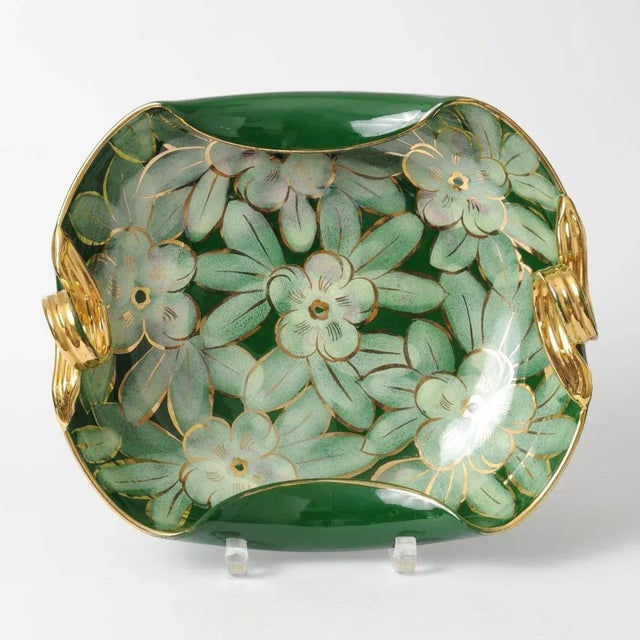 Vintage Italian ceramic bowl. Decorated with glazed flowers and fancy gold-plated lugs.