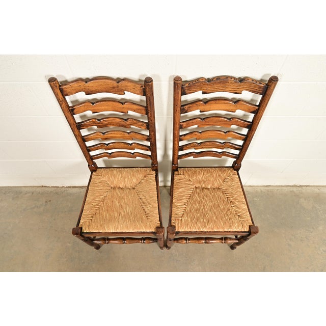 1980s Baker Furniture Style English Country Rustic Carved Solid Oak Ladder Back Dining Chairs With Rush Seats, Pair For Sale - Image 5 of 13