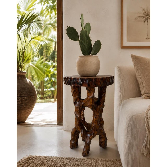 Striking vintage plant stand hand-carved from solid mahogany wood, featuring a sculptural organic form with openwork...