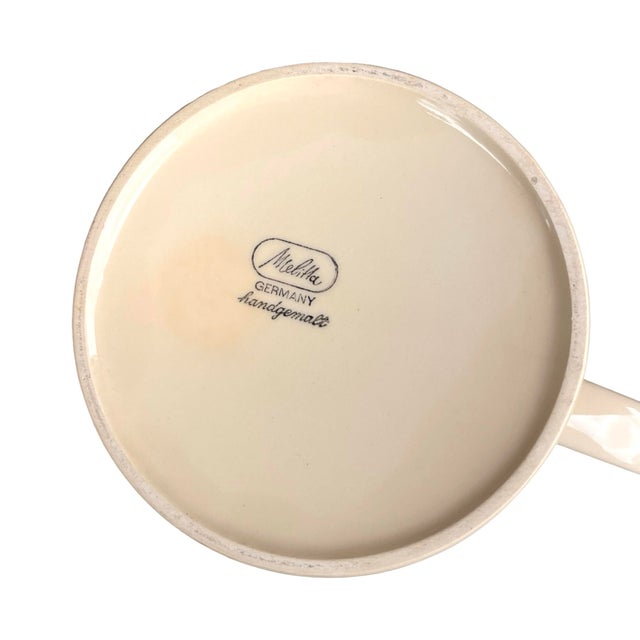 A stylish Melitta coffee set from the 1970s, crafted from high-quality ceramic. Decorated in a color palette typical of...