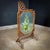 This stylish antique hair screen has a man painting on the glass and is dated circa 1880. This special copy is made of...