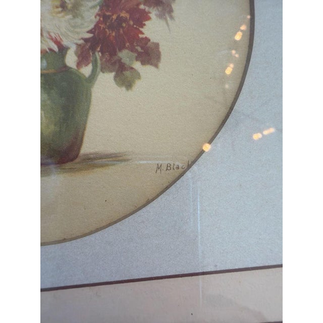 Vintage 1940-1950’s Floral Lithograph Print by artist M. Black. This charming mid-century piece features a vibrant bouquet...