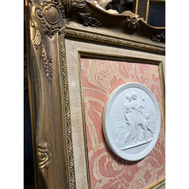 Vintage Italian Souvenir of grand tour Porcelain Medallion on gilded Frame Against a Fortuny Fabric Background.medallion...