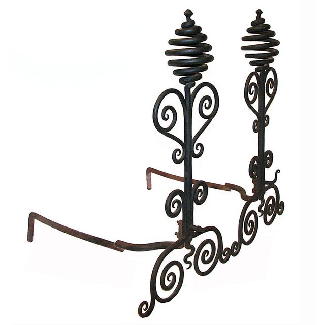 Early 20th century hand wrought andirons having scroll and corkscrew motif.