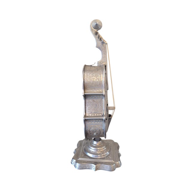 Very cool and very rare antique silverplate violin with a working music box and secret drawer. It's a gorgeous piece with...