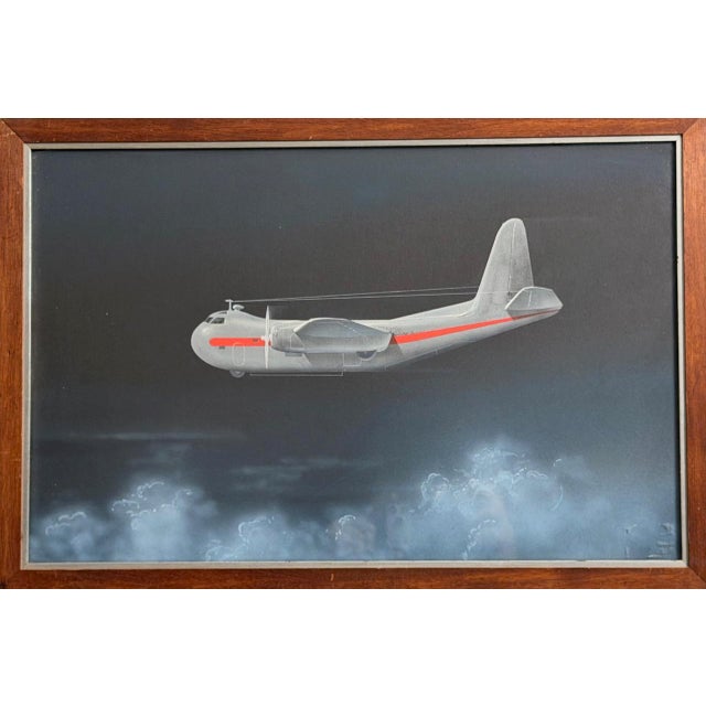 A rare original oil painting of the first US Navy cargo plane built during WW2. Oil on board. Framed in its original wood...