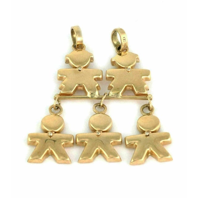 This product is a charming 14k yellow gold pendant featuring five kids dangling from it. The vintage charm style adds a...