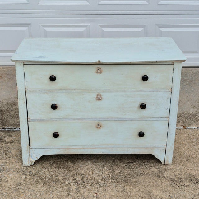 This is a charming antique painted chest of drawers. The dresser is unsigned but was likely made in the United States,...