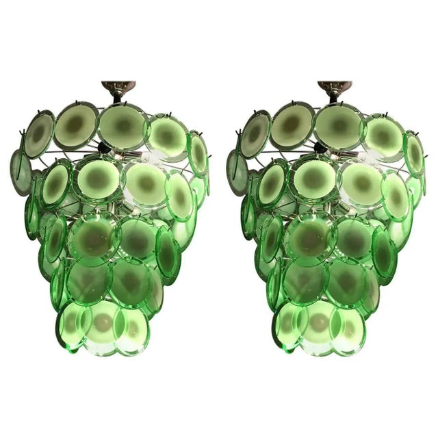 A pair of art deco style circular Murano glass sphere chandeliers. Each having fifty circular Murano glass spheres...