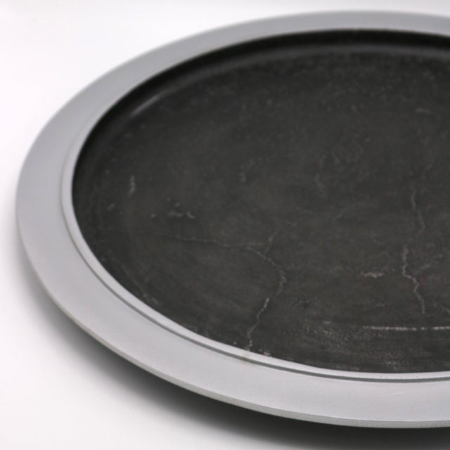 A Modernist round tray by artist Lorenzo Burchiellaro. Textured cast aluminum. Signed Burchiellaro.