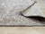 A 6' x 9' hand-knotted wool rug with a softly faded ivory and powder blue field with a classic central medallion and a...