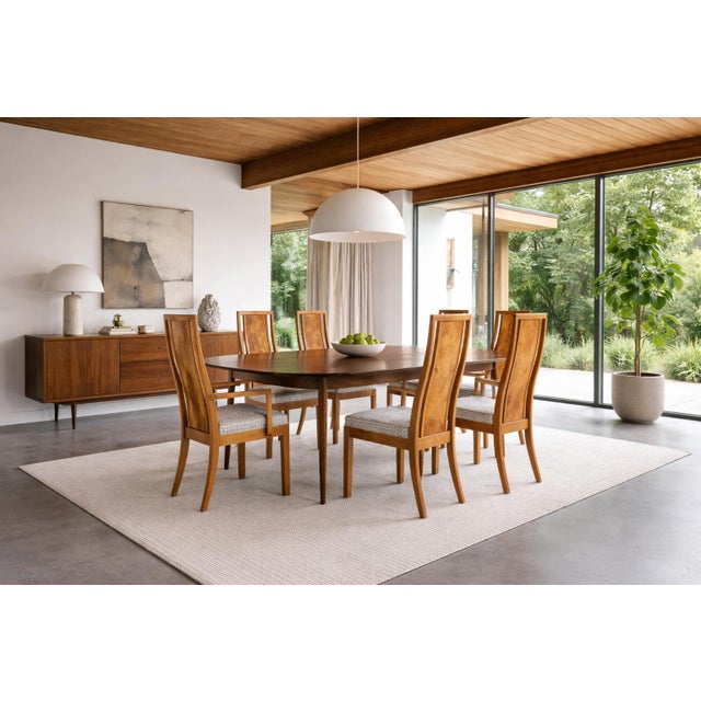 A stunning set of six mid-century dining chairs that exemplify the sophisticated craftsmanship of 1970s American design....