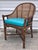 Beautiful vintage mid century McGuire rattan and cane arm chair. Teal leather cushion. Wrapped in leather ties. Rattan and...