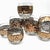 A sophisticated set of eight vintage bar glasses featuring a classic 22-karat gold Greek Key motif on clear glass. This...