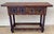 20th-century console table with slab top on a frieze with two drawer fronts decorated with carved and incised floral...