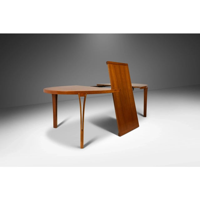 Introducing a rare and exquisite expansion dining table by the renowned Sven Ellekaer for Heltborg Møbler. Designed in the...