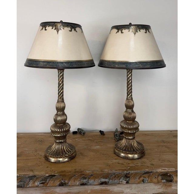 A magnificent and highly decorative pair of vintage Italian Baroque table lamps, rendered as monumental twisted...