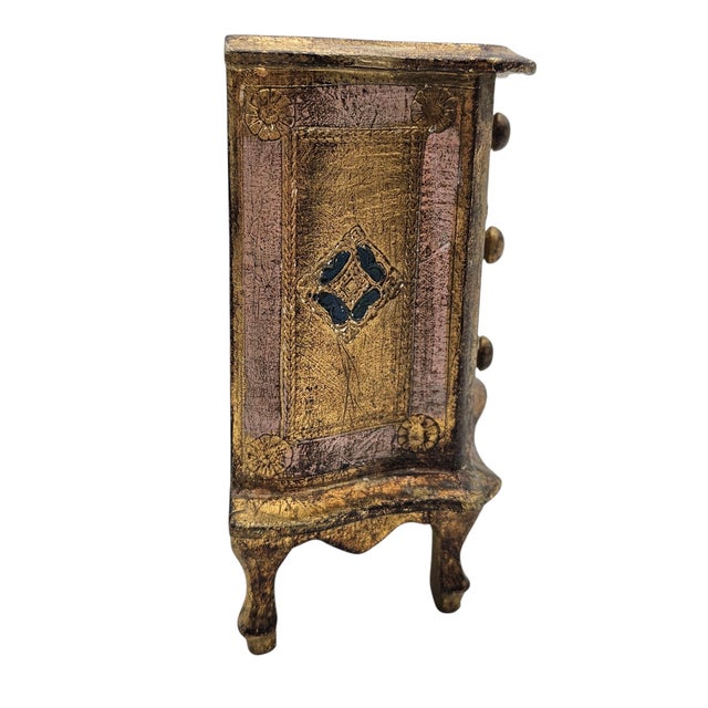 This mid-century Italian Florentine jewelry chest exemplifies the theatrical elegance associated with postwar Italian...