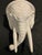 Large mid-century elephant head design in glazed white ceramic pottery. Flat platform top for display use. Hand painted....