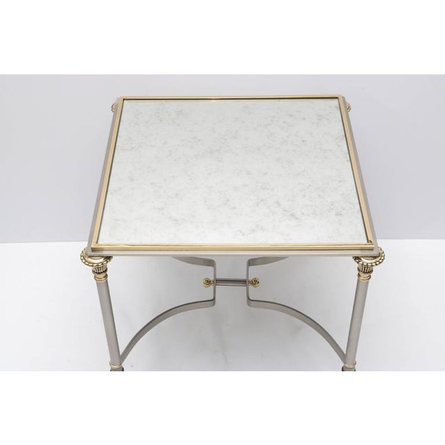 This stylish side table with its Louis XVI lines is very much in the style of pieces created by Maison Jansen. The...