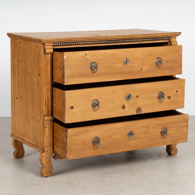 Late 19th century large Hungarian chest of three drawers, crafted in pine with a warm waxed finish. Three generously sized...