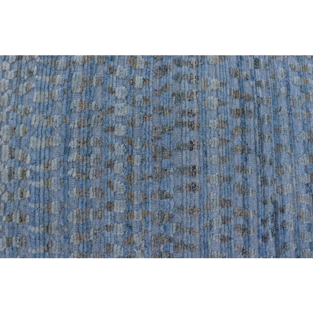 Measures 8'1 x 9'11 This particular piece has a luxurious texture, the field is a soft sky blue, with specks of green...