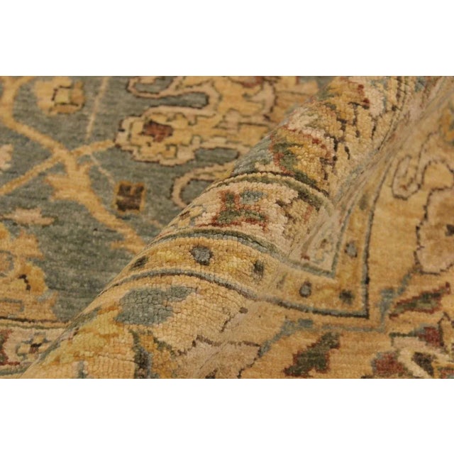 This gorgeous transitional handmade rug follows an abstract pattern which exotically repeat like a continuous reflection....