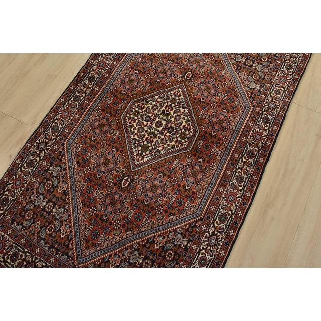 An authentic vintage traditional Bidjar rug hand-knotted with fine wool and natural dyes. This intricately woven oriental...