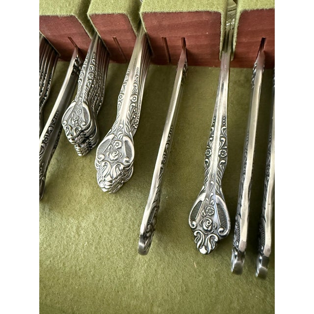Add a touch of elegance to your dining experience with this fifty piece set, service for eight stainless steel flatware...