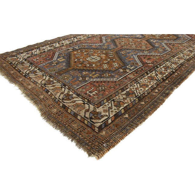 Distressed Vintage Persian Shiraz Rug with Tribal Style 04'06 x 06'10. Warm and inviting with rustic sensibility, this...