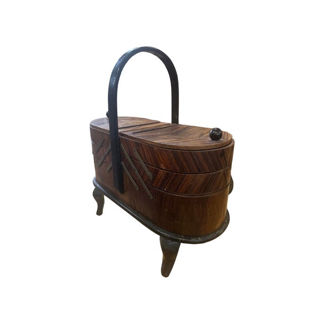 Rare sewing cabinet from the early 1900s, dating back to the Art Deco period. The cabinet stands on four legs with a...