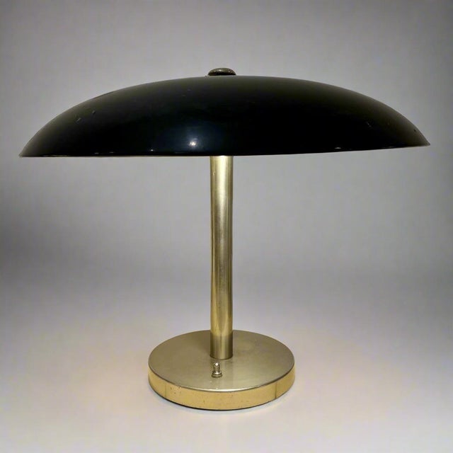 An Art Deco period desk lamp from Germany circa 1930. Black enamel and polished steel. Dimensions: H:15 Shade Diameter:18...