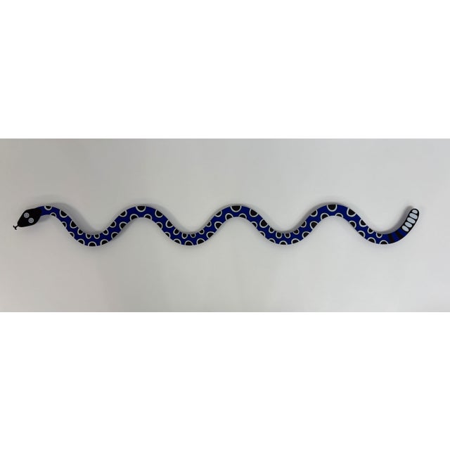 Alexander Girard designed the Magic Snake motif for his exhibit of folk art at the International Exposition 'HemisFair...