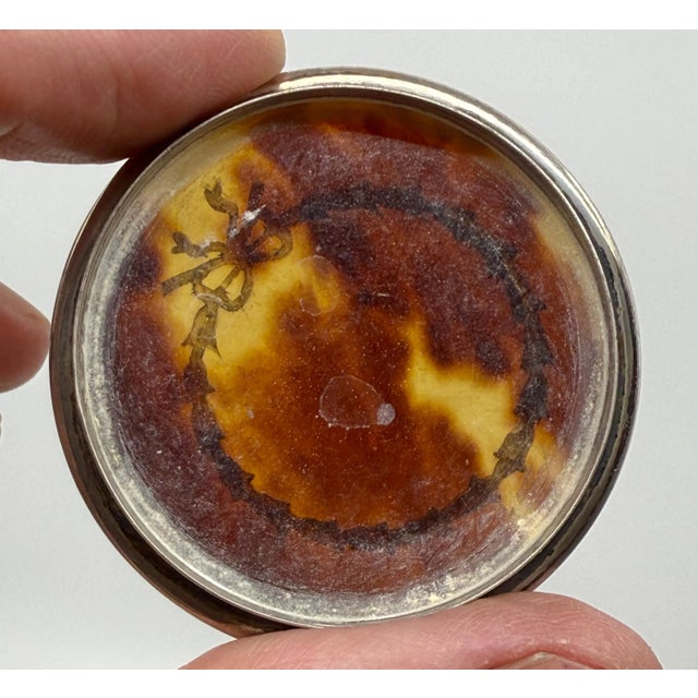 A nice pair of horn of silver snuff or trinket boxes. One is hallmarked with English Sterling hallmarks the other I...