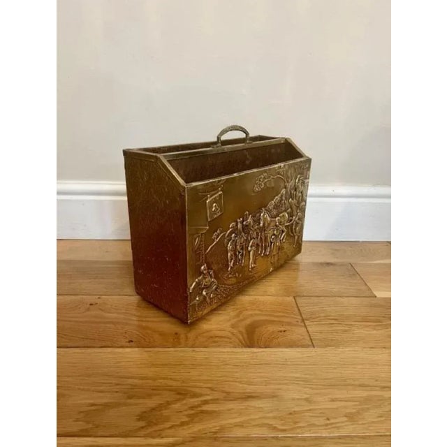 Antique ornate quality brass newspaper stand having a quality brass newspaper stand with ornate decoration of people...