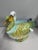 A finely modeled and richly hand-painted Italian figural soup tureen depicting a pair of elegantly rendered ducks,...