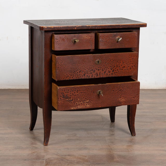 20th-century Danish small chest of drawers crafted in pine with an original painted finish. The surface is deliberately...