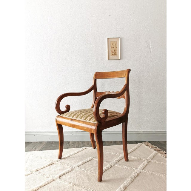 This armchair dates from the 1830s and has classic Biedermeier elements - visual simplicity, light woods and contrasting...