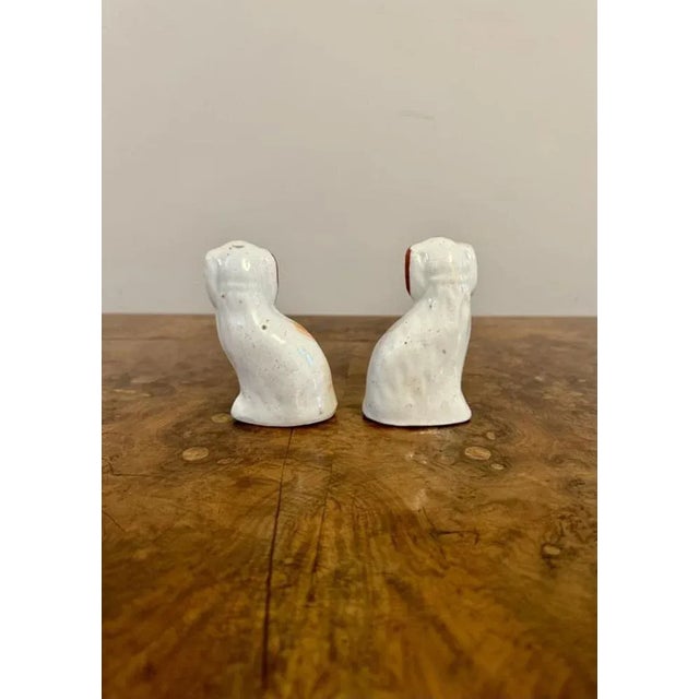 Lovely pair of antique Victorian miniature Staffordshire dogs, having a lovely pair of antique Victorian Staffordshire...