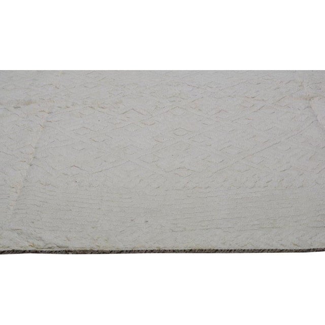 Hand-knotted with care using traditional rug-making techniques, this wool rug blends timeless craftsmanship with a modern...