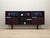 The bookcase was made in the 1970s, designed by leading Danish designer Ib Kofod Larsen. The structure is covered with...