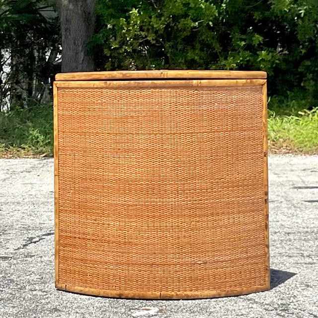 Elevate your coastal décor with this Vintage Coastal Woven Rattan Hamper. Crafted in America, this hamper blends...
