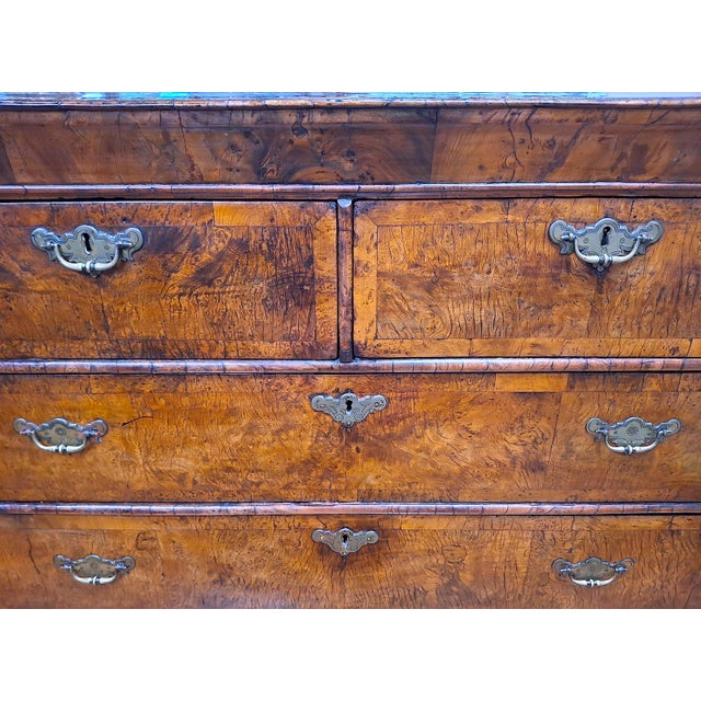 On offer is a classic English burr walnut chest-on-stand so gorgeous that even if you live in a minimalist’s environment...
