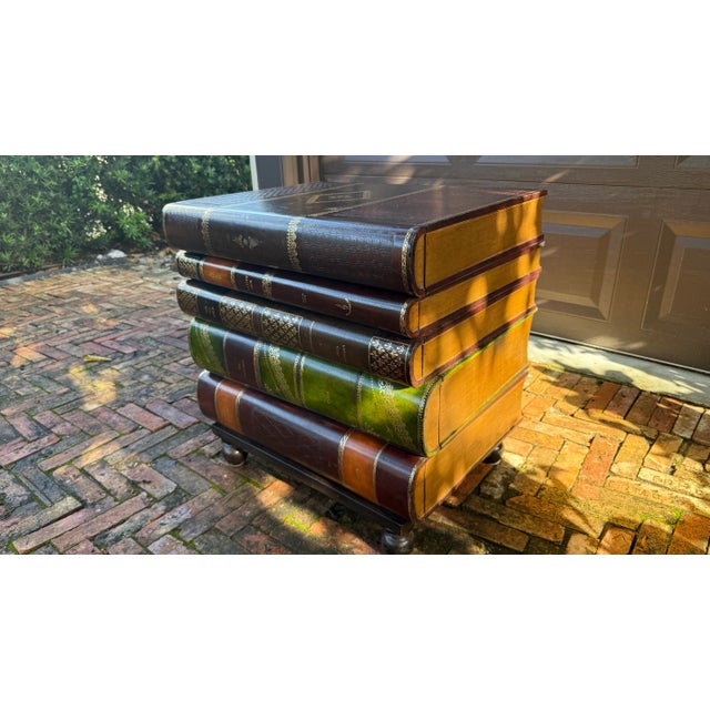 This whimsical and collectible Maitland-Smith table is handmade in the Philippines and designed to look like a dramatic...